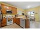 Well-lit kitchen features a microwave, stove and dishwasher with a breakfast area at 2152 Haig Point Way, Raleigh, NC 27604