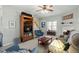 Inviting living space with a fireplace, comfortable sofa and a flat-screen TV on a bookshelf at 2152 Haig Point Way, Raleigh, NC 27604