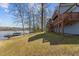 Backyard sloping to the lake with boat dock at 220 Choctaw Dr, Louisburg, NC 27549
