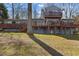 View of the rear of the house with multiple decks and lake access at 220 Choctaw Dr, Louisburg, NC 27549