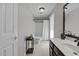 Bathroom with tiled floors, a large mirror, and a combined shower-tub at 220 Choctaw Dr, Louisburg, NC 27549