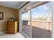 A bedroom with access to outdoor deck overlooking the lake at 220 Choctaw Dr, Louisburg, NC 27549