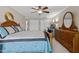 A bedroom with a desk, dresser, and double closets at 220 Choctaw Dr, Louisburg, NC 27549