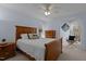 Bedroom with hardwood furniture, neutral carpet and blue walls at 220 Choctaw Dr, Louisburg, NC 27549