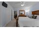 Primary bedroom with closet space and view to sitting area at 220 Choctaw Dr, Louisburg, NC 27549