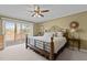 A bedroom with access to outdoor deck overlooking the lake at 220 Choctaw Dr, Louisburg, NC 27549