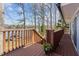 Multi-level deck with scenic lake views and stairs leading to the water at 220 Choctaw Dr, Louisburg, NC 27549