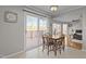 A dining area adjacent to the kitchen and with access to a deck overlooking the lake at 220 Choctaw Dr, Louisburg, NC 27549