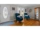 Cozy entryway with hardwood floors, comfortable seating, and decorative accents at 220 Choctaw Dr, Louisburg, NC 27549