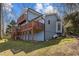 Exterior view of lake house with multi-level decks at 220 Choctaw Dr, Louisburg, NC 27549