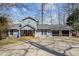 Charming two-story home with a spacious front yard and attached three car garage at 220 Choctaw Dr, Louisburg, NC 27549