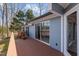 Exterior view of the house with a deck and sliding glass doors at 220 Choctaw Dr, Louisburg, NC 27549