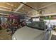 Spacious garage with high ceilings featuring kayaks and a car at 220 Choctaw Dr, Louisburg, NC 27549