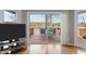 Cozy living room with hardwood floors, sliding doors to deck and lake view at 220 Choctaw Dr, Louisburg, NC 27549