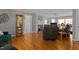 Inviting living room with a fireplace, hardwood floors, and lake views at 220 Choctaw Dr, Louisburg, NC 27549