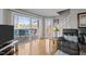 Living room showing hardwood floors, lake view deck, and staircase at 220 Choctaw Dr, Louisburg, NC 27549