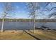 Scenic lake view with a private dock, perfect for boating and enjoying the waterfront at 220 Choctaw Dr, Louisburg, NC 27549