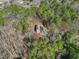 Aerial view of a charming home nestled among lush greenery with a wooded landscape for a serene and private setting at 2431 Winburn Ave, Durham, NC 27704