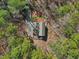 Home nestled among tall trees with long driveway, offering privacy and seclusion at 2431 Winburn Ave, Durham, NC 27704