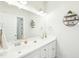 Modern bathroom with double sink vanity, large mirror, and updated lighting fixtures at 2431 Winburn Ave, Durham, NC 27704