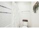 Clean bathroom with a bathtub, shower curtain, toilet, and tiled walls at 2431 Winburn Ave, Durham, NC 27704