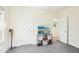Bedroom with neutral carpet, and a TV with a stand for storage at 2431 Winburn Ave, Durham, NC 27704