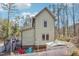 Exterior view of a two-story house with a deck, patio, and white picket fence at 2431 Winburn Ave, Durham, NC 27704