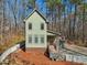Attractive two-story home with a front porch, landscaped garden, and white picket fence at 2431 Winburn Ave, Durham, NC 27704
