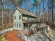 Charming two-story home with a spacious front porch, landscaped yard, and a deck at 2431 Winburn Ave, Durham, NC 27704