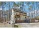 Exterior of home with multiple decks, a white picket fence, and landscaping at 2431 Winburn Ave, Durham, NC 27704
