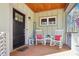 Charming front porch with rocking chairs, welcome sign, and a wood ceiling at 2431 Winburn Ave, Durham, NC 27704