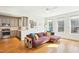 Bright living room featuring a comfortable sofa, hardwood floors, and an open floor plan at 2431 Winburn Ave, Durham, NC 27704