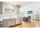 Sun-filled living room showcases a sleek fireplace and open layout to the kitchen at 2431 Winburn Ave, Durham, NC 27704