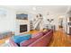 Comfortable living room featuring a fireplace, hardwood floors, and an open floor plan at 2431 Winburn Ave, Durham, NC 27704