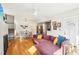 Bright living room featuring a comfortable sofa, hardwood floors, and an open floor plan at 2431 Winburn Ave, Durham, NC 27704