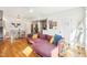 Bright living room featuring a comfortable sofa, hardwood floors, and an open floor plan at 2431 Winburn Ave, Durham, NC 27704