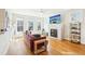 Sun-filled living room with fireplace and stylish decor opens to the modern kitchen at 2431 Winburn Ave, Durham, NC 27704