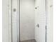 Shower with a glass door, white tiles, and modern fixtures and hardware at 2431 Winburn Ave, Durham, NC 27704