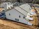 An aerial view shows the community has multiple rows of townhomes with off-street parking at 3015 Cypress Lagoon Ct, Durham, NC 27703