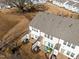 An aerial view of the townhome backyard shows an AC unit, patios and lush landscaping at 3015 Cypress Lagoon Ct, Durham, NC 27703