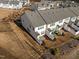 An aerial view shows the community is composed of multiple rows of townhomes and manicured landscaping at 3015 Cypress Lagoon Ct, Durham, NC 27703