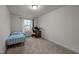 Cozy bedroom with carpet, desk, and a window offering natural light at 3015 Cypress Lagoon Ct, Durham, NC 27703