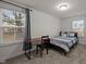 Bedroom with carpeting, large windows, and a desk for working or studying at 3015 Cypress Lagoon Ct, Durham, NC 27703