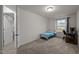Bright bedroom with carpeting, a window, desk, and convenient access to other rooms at 3015 Cypress Lagoon Ct, Durham, NC 27703