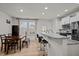 Bright kitchen and dining area with granite countertops and stainless steel appliances at 3015 Cypress Lagoon Ct, Durham, NC 27703