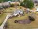 Aerial view of beautiful home featuring a spacious yard with mature trees at 3112 Gold Dust Ln, Willow Springs, NC 27592