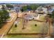 Overhead view of large backyard, wooden fence surrounding property, with pergola and shed, near residential area at 3112 Gold Dust Ln, Willow Springs, NC 27592