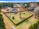 Expansive fenced backyard with a charming house, shed, and pergola, offering ample space and privacy at 3112 Gold Dust Ln, Willow Springs, NC 27592