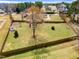 Aerial view of the home, with a large, well-maintained lawn and a sturdy wooden fence at 3112 Gold Dust Ln, Willow Springs, NC 27592