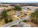 Beautiful home with lush backyard and a wooden fence, plus a charming storage shed and pergola at 3112 Gold Dust Ln, Willow Springs, NC 27592